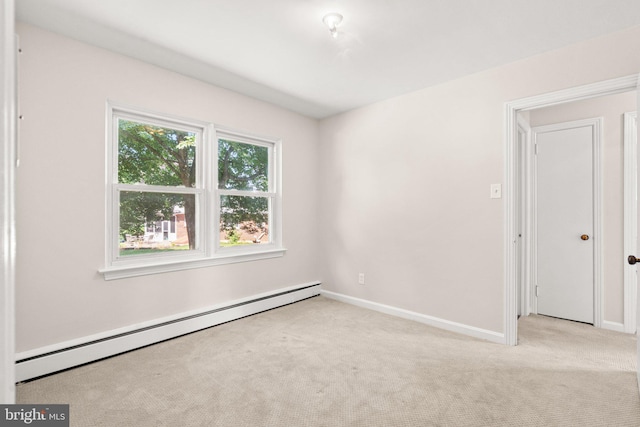 102 Deaven Rd, Harrisburg, PA 17112 - empty room with a baseboard radiator and light carpet