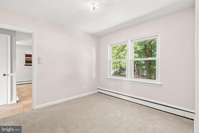 102 Deaven Rd, Harrisburg, PA 17112 - empty room featuring a baseboard heating unit and carpet