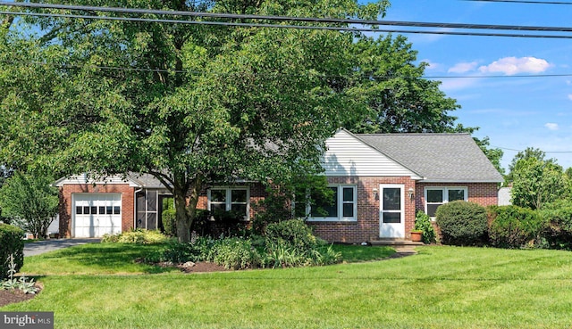 102 Deaven Rd, Harrisburg, PA 17112 - view of front facade with brick siding, an attached garage, a front yard, and driveway