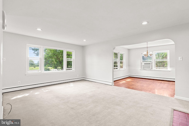 102 Deaven Rd, Harrisburg, PA 17112 - carpeted spare room featuring a baseboard radiator, arched walkways, a chandelier, healthy amount of natural light, and recessed lighting