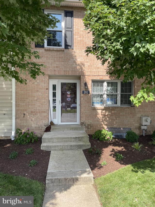 202 Meadow Ct Unit 202, Glen Mills, PA 19342 - doorway to property featuring brick siding
