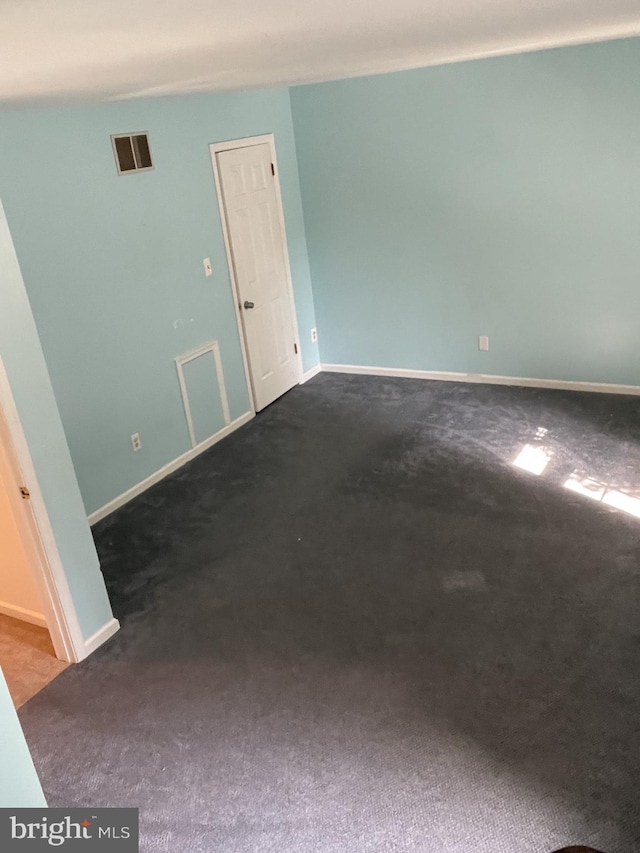 202 Meadow Ct Unit 202, Glen Mills, PA 19342 - empty room with dark carpet and baseboards
