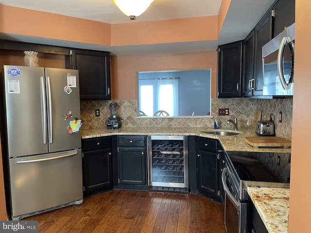 202 Meadow Ct Unit 202, Glen Mills, PA 19342 - kitchen with stainless steel appliances, wine cooler, dark wood-type flooring, dark cabinetry, and light stone countertops