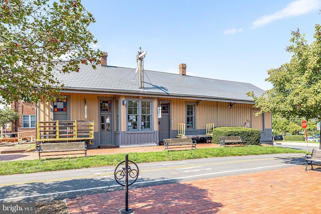815 Branch Dr Unit 305, Herndon, VA 20170 - view of front of house featuring a chimney and covered porch