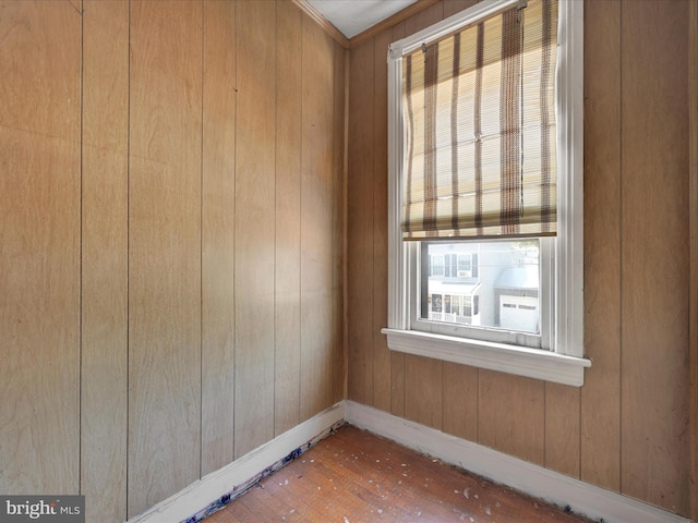 234 N Coal St, Port Carbon, PA 17965 - empty room with hardwood / wood-style floors and wooden walls