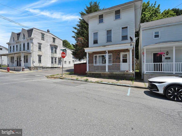 234 N Coal St, Port Carbon, PA 17965 - view of property featuring a porch and brick siding