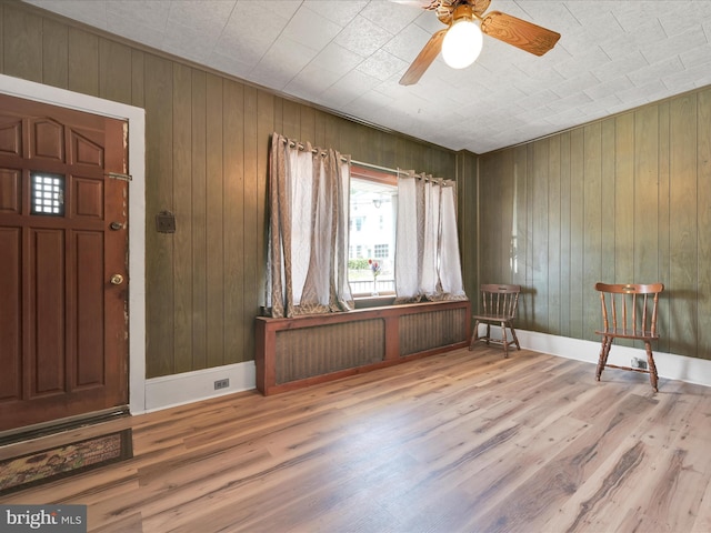 234 N Coal St, Port Carbon, PA 17965 - foyer entrance with wood finished floors, ceiling fan, and wooden walls