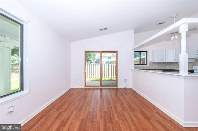 18503 Nutmeg Pl, Germantown, MD 20874 - spare room featuring vaulted ceiling, wood finished floors, and ceiling fan