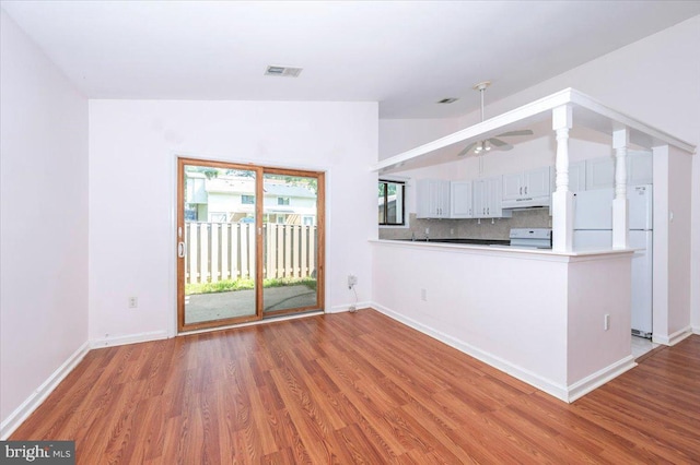 18503 Nutmeg Pl, Germantown, MD 20874 - unfurnished living room featuring light wood-style floors, lofted ceiling, and ceiling fan