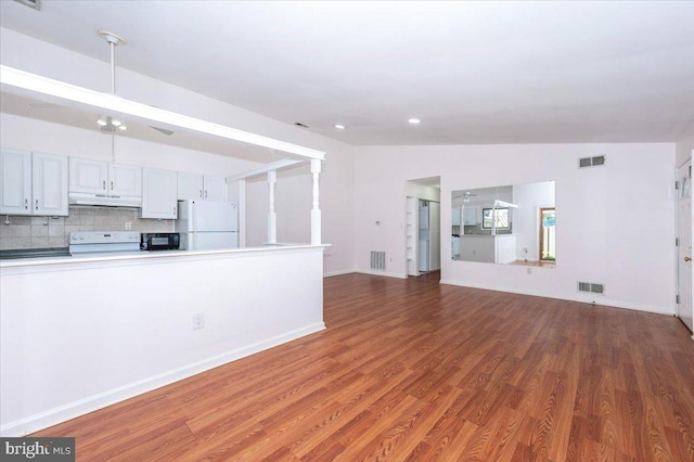 18503 Nutmeg Pl, Germantown, MD 20874 - unfurnished living room with wood finished floors and recessed lighting