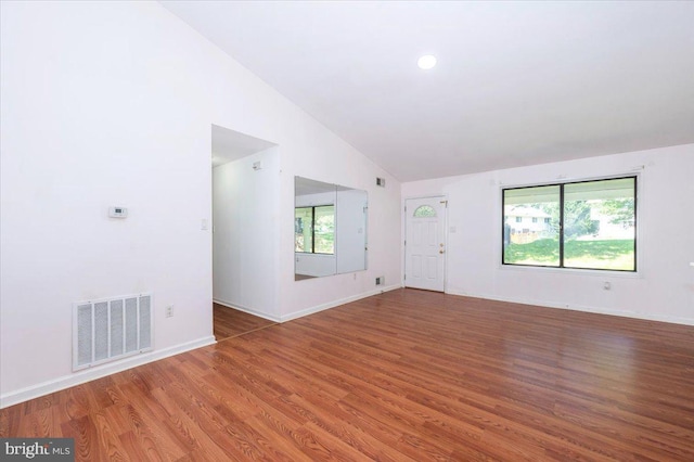 18503 Nutmeg Pl, Germantown, MD 20874 - unfurnished living room featuring vaulted ceiling, wood finished floors, and recessed lighting