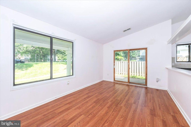 18503 Nutmeg Pl, Germantown, MD 20874 - unfurnished room featuring lofted ceiling and wood finished floors