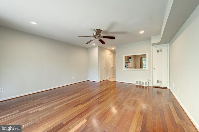 8218 Carrleigh Pkwy Unit 10, Springfield, VA 22152 - unfurnished living room with ceiling fan, hardwood / wood-style floors, and recessed lighting