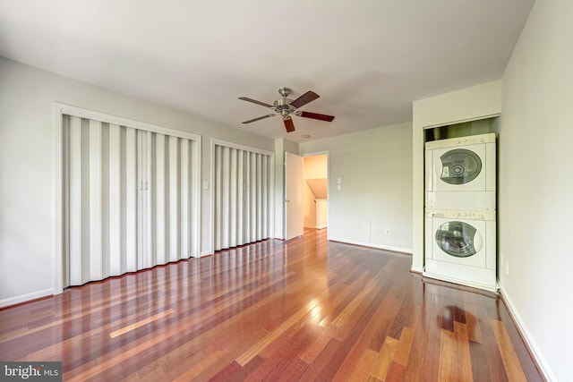 8218 Carrleigh Pkwy Unit 10, Springfield, VA 22152 - laundry area with estacked washer and dryer, ceiling fan, and wood finished floors