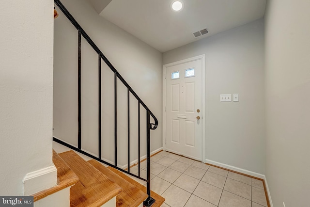 8218 Carrleigh Pkwy Unit 10, Springfield, VA 22152 - foyer entrance with light tile patterned floors and stairway