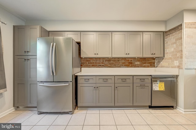 8218 Carrleigh Pkwy Unit 10, Springfield, VA 22152 - kitchen featuring appliances with stainless steel finishes, gray cabinets, and light tile patterned flooring