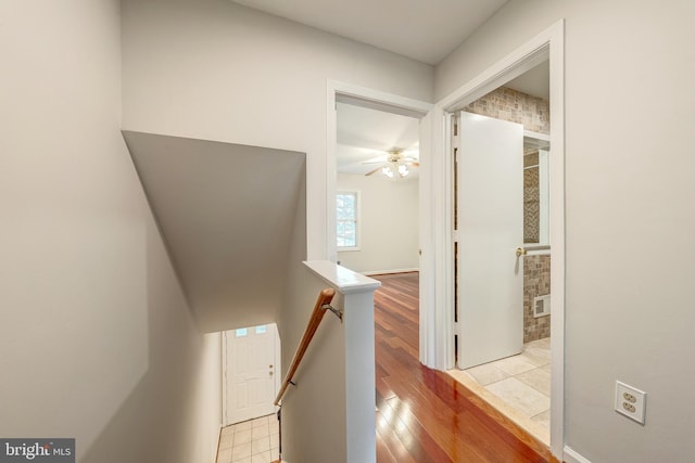 8218 Carrleigh Pkwy Unit 10, Springfield, VA 22152 - hallway with an upstairs landing and wood finished floors