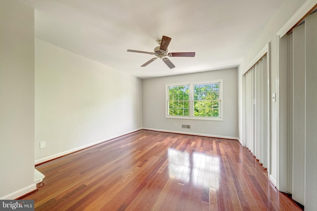 8218 Carrleigh Pkwy Unit 10, Springfield, VA 22152 - unfurnished bedroom with wood finished floors, ceiling fan, and a closet