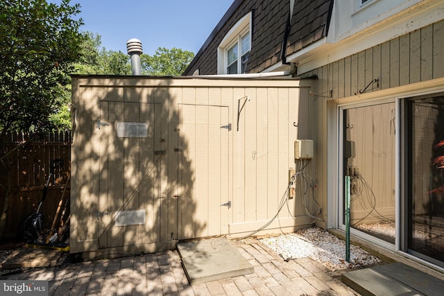8218 Carrleigh Pkwy Unit 10, Springfield, VA 22152 - view of side of home with a shed and mansard roof