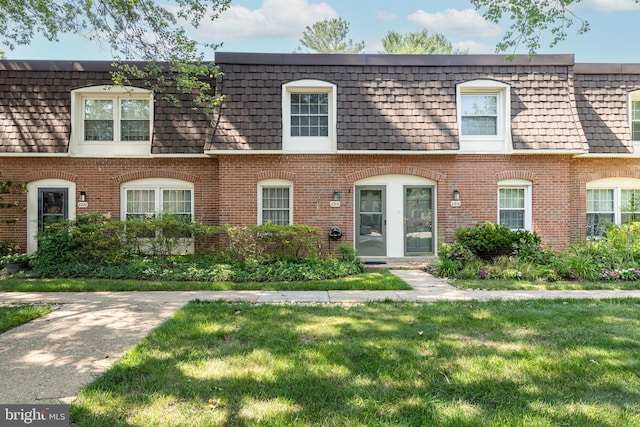 8218 Carrleigh Pkwy Unit 10, Springfield, VA 22152 - view of property with brick siding, a front yard, and mansard roof