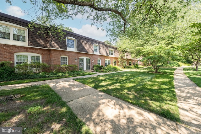 8218 Carrleigh Pkwy Unit 10, Springfield, VA 22152 - view of front of property featuring brick siding, mansard roof, and a front yard