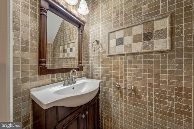 8218 Carrleigh Pkwy Unit 10, Springfield, VA 22152 - bathroom with tile walls, vanity, and vaulted ceiling