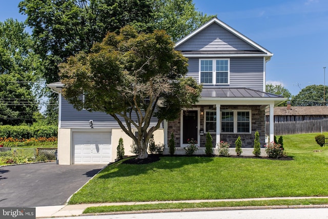 228 Warren Blvd, Broomall, PA 19008 - view of front of house featuring a standing seam roof, asphalt driveway, a garage, a porch, and stone siding
