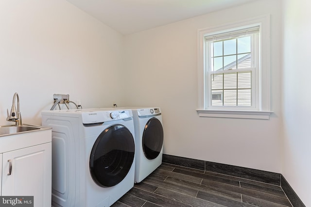 228 Warren Blvd, Broomall, PA 19008 - laundry area featuring washer and clothes dryer, wood finish floors, and cabinet space