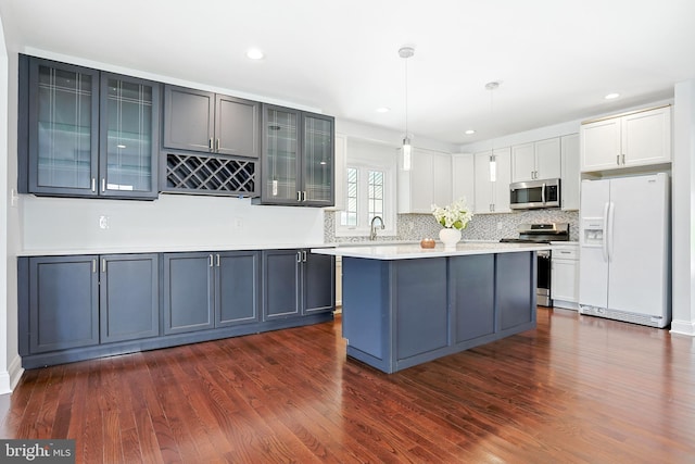 228 Warren Blvd, Broomall, PA 19008 - kitchen featuring stainless steel appliances, dark wood finished floors, light countertops, and recessed lighting