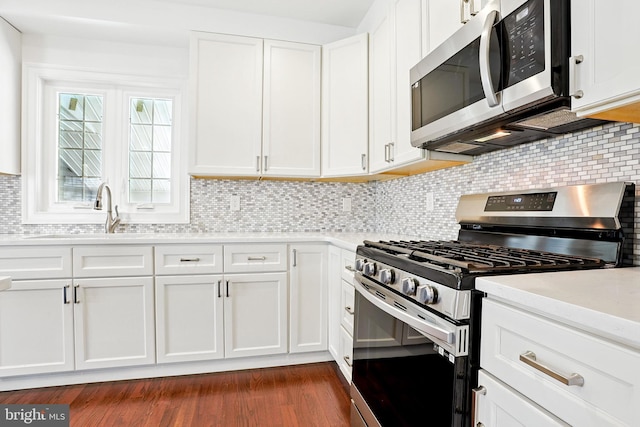 228 Warren Blvd, Broomall, PA 19008 - kitchen featuring appliances with stainless steel finishes, light countertops, and white cabinets