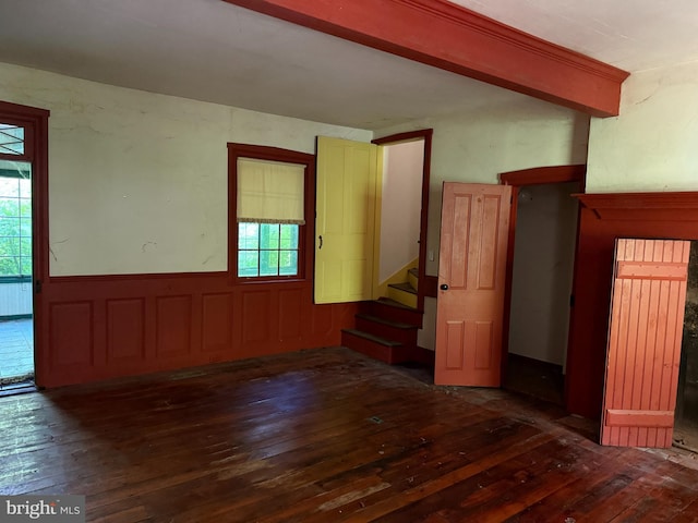 10 Kricks Mill Rd, Womelsdorf, PA 19567 - empty room featuring hardwood / wood-style flooring, stairway, a wainscoted wall, and radiator heating unit