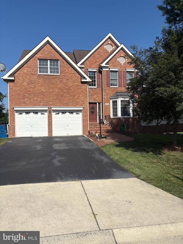 20385 Medalist Dr, Ashburn, VA 20147 - traditional home featuring asphalt driveway, an attached garage, brick siding, and a front yard