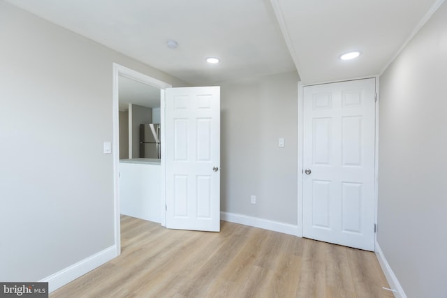 136 Chadwick Ave, Linwood, PA 19061 - unfurnished bedroom with freestanding refrigerator, light wood finished floors, and recessed lighting