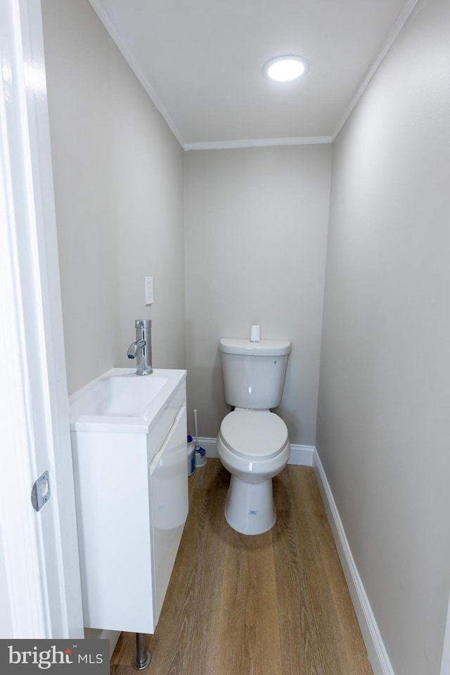 136 Chadwick Ave, Linwood, PA 19061 - bathroom featuring vanity, wood finished floors, and ornamental molding