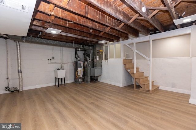 136 Chadwick Ave, Linwood, PA 19061 - unfinished basement with gas water heater, wood finished floors, stairway, and heating unit