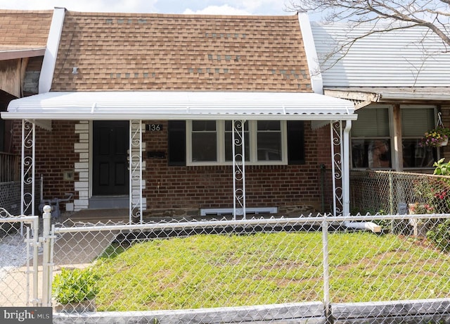 136 Chadwick Ave, Linwood, PA 19061 - view of front of home featuring a shingled roof and brick siding
