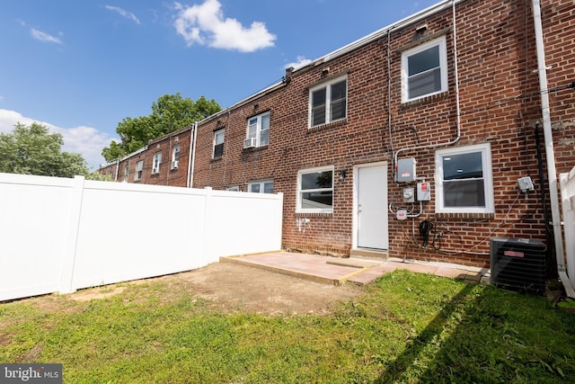 136 Chadwick Ave, Linwood, PA 19061 - back of house featuring a fenced backyard, brick siding, and a patio area