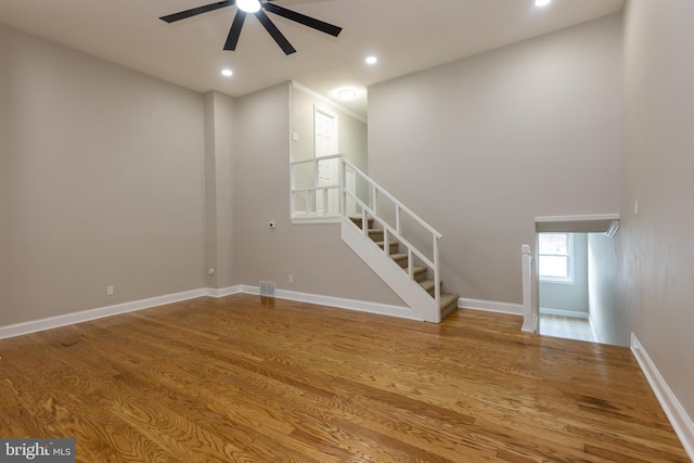 136 Chadwick Ave, Linwood, PA 19061 - unfurnished living room with a ceiling fan, stairway, wood finished floors, and recessed lighting