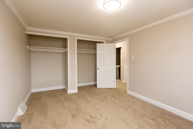 136 Chadwick Ave, Linwood, PA 19061 - unfurnished bedroom with two closets, carpet, and crown molding