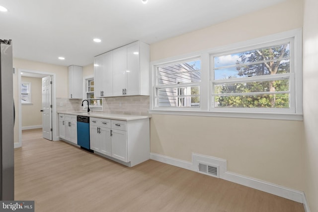 19 Glen Stewart Dr, Ewing, NJ 08618 - kitchen with light wood-style floors, dishwashing machine, white cabinets, light countertops, and recessed lighting