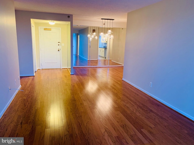 5800 Nicholson Ln Unit 1-908, Rockville, MD 20852 - empty room with wood finished floors and a chandelier