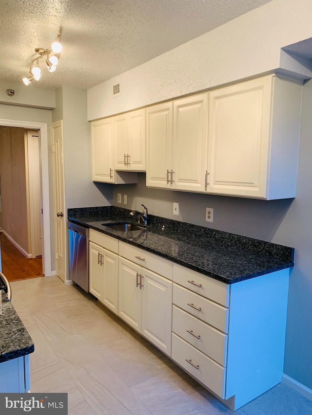 5800 Nicholson Ln Unit 1-908, Rockville, MD 20852 - kitchen with stainless steel dishwasher, white cabinetry, a textured ceiling, and dark stone counters