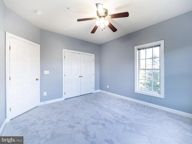 591 Odendhal Ave Unit 591, Gaithersburg, MD 20877 - unfurnished bedroom with carpet, a closet, and a ceiling fan