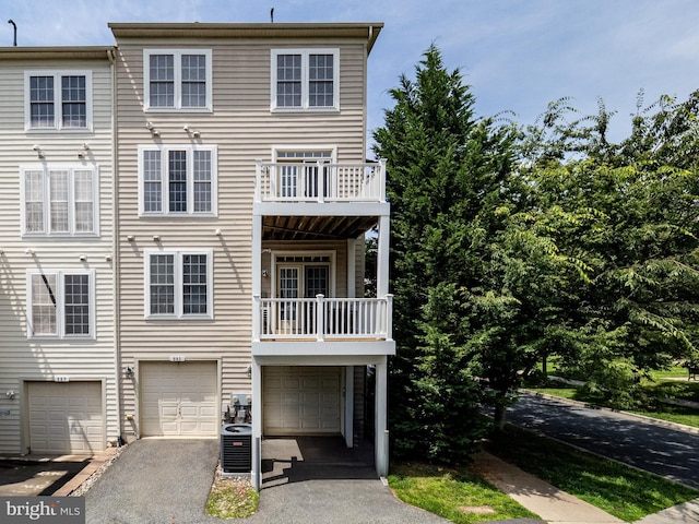591 Odendhal Ave Unit 591, Gaithersburg, MD 20877 - view of front of property featuring a balcony, a garage, and driveway