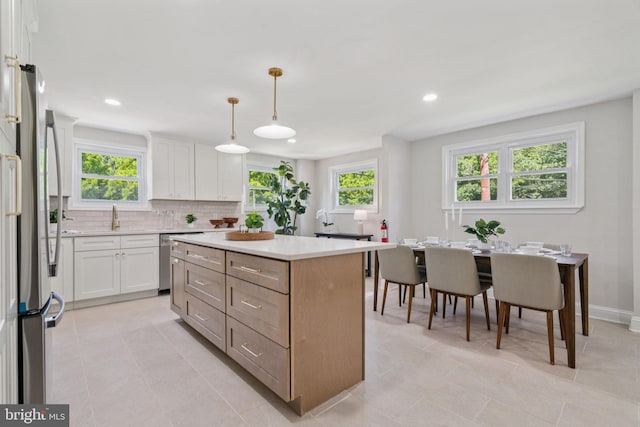 805 Windsor Cir, Folcroft, PA 19032 - kitchen with appliances with stainless steel finishes, a center island, light countertops, backsplash, and recessed lighting