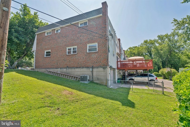 805 Windsor Cir, Folcroft, PA 19032 - view of home's exterior with brick siding, a chimney, and a deck