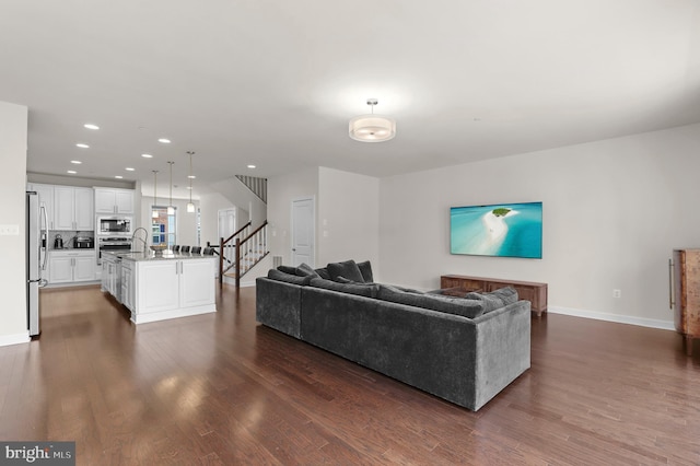 1025 Mutual Pl, Sandy Spring, MD 20860 - living area featuring dark wood finished floors, stairs, and recessed lighting