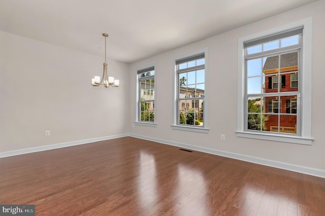 1025 Mutual Pl, Sandy Spring, MD 20860 - empty room with a chandelier and dark wood-style flooring