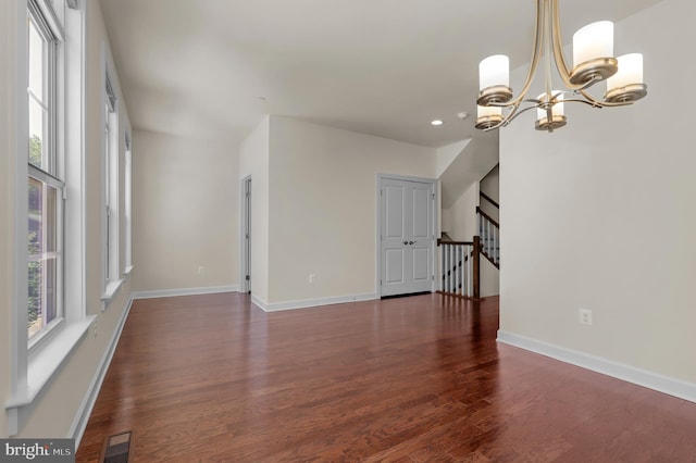 1025 Mutual Pl, Sandy Spring, MD 20860 - unfurnished living room with a chandelier, wood finished floors, recessed lighting, and stairs