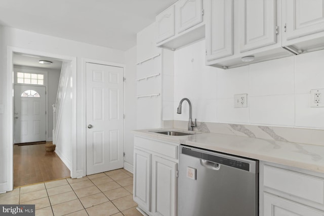 1816 Chilton St, Baltimore, MD 21218 - kitchen featuring stainless steel dishwasher, white cabinetry, and light tile patterned flooring